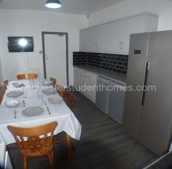 There is an American Style Fridge Freezer with an extra fridge and freezer under counter