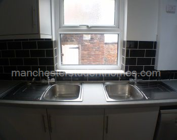 Kitchen has a double sink as well as a dishwasher