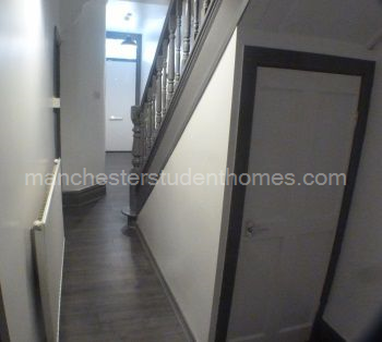 Hallway has laminate flooring and the stairs and landing have carpets