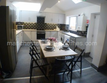 Kitchen has an American Style Fridge Freezer, oven with induction hob and extractor, washing machine and tumble dryer with microwave