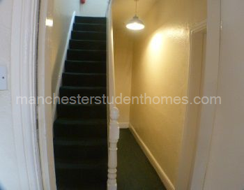 Stairs to second floor; stairs and landings are carpeted